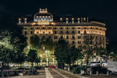 Milan, Italy - August 19, 2024: The facade of the Albergo Gallia hotel in Milan at night clipart