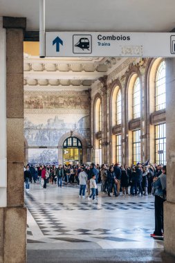 Porto, Portugal - December 28, 2024: Famous hall of Sao Bento station decorated with azulejos in Porto, Portugal clipart