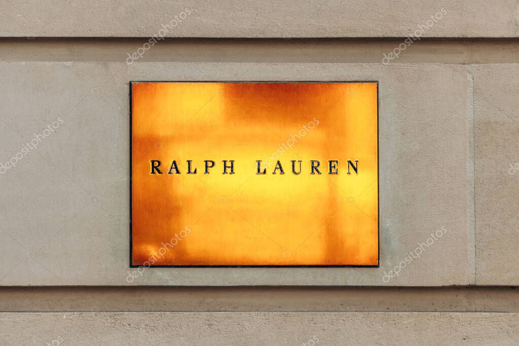 Paris, France - September 6, 2025: Ralph Lauren gold plaque on exterior wall near Place de la Madeleine