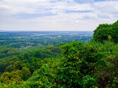 Foggy sky and view from the top of the hill. View of the fields seen from the top of the hill