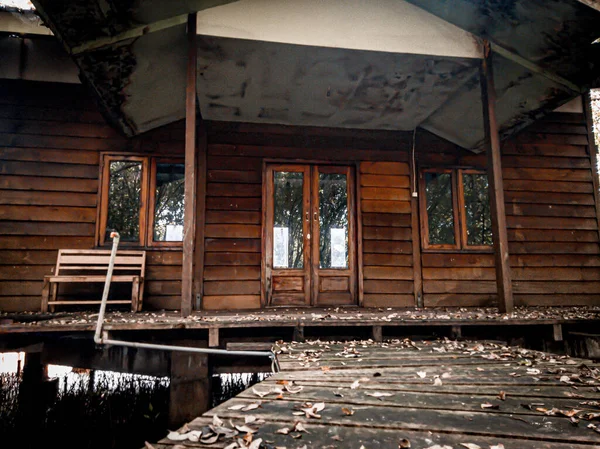 Abandoned empty wooden house building in the forest with a spooky atmosphere. Abandoned wooden house scary and creppy