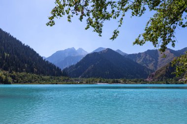 Unusually beautiful turquoise lake Issyk in the mountains of Kazakhstan. 85 km from Almaty