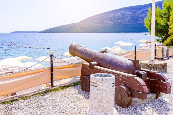 Old cannon in the Kanli Kula (Bloody Tower) fortress against the backdrop of the sea and mountains, Herceg Novi, Montenegro