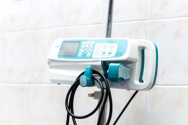 the image of a digital thermometer for temperatureoperating room in a hospital, syringe pump, administration of drug solutions, infusion machine, intensive care equipment