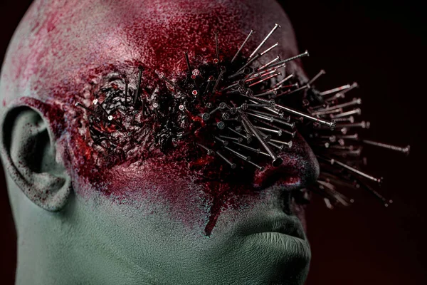 Demon man with spikes on the eyes. Halloween concept makeup. bloody image for the holiday