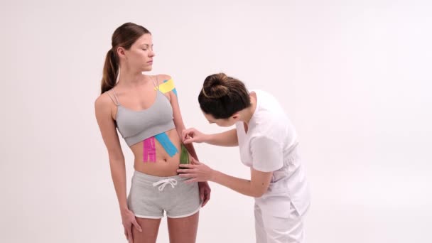 Kinesio Tape Girl Belly Young Caucasian Girl Kinesiology Elastic Therapeutic — ストック動画