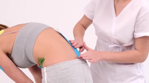 Young Woman Kinesio Tape Her Back Sides Kinesio Taping Lifting — Vídeo de Stock