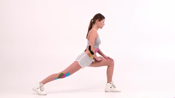 Woman Doing Stretching Exercise White Background Using Tape Stretch Muscles — Αρχείο Βίντεο