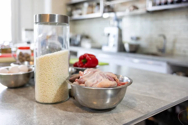 stock image Quail carcasses lie bowl in metal bowl. Small birds are prepared for cooking. Beckground of the kitchen