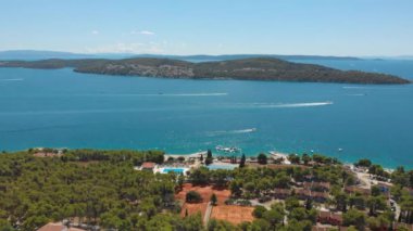 Croatia. Bay on the coast of the Adriatic Sea. Summer. Tourist season. Popular place to relaxation. Drone. Aerial view. The camera moves from left to right