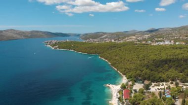Croatia. Bay on the coast of the Adriatic Sea. Summer. Tourist season. Popular place to relaxation. Drone. Aerial view. The camera moves forward