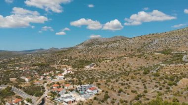 Croatia. Coast of the Adriatic Sea. Small town by the sea. Summer. Tourist season. Popular place to relaxation. Drone. Aerial view. Panorama. The camera moves from right to left