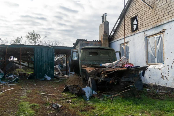 stock image War in Ukraine. 2022 Russian invasion of Ukraine. Countryside. A damaged truck stands near a destroyed house. No people. War crimes