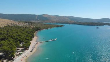Croatia. Bay with yachts on the Adriatic coast. Summer. Tourist season. Popular place to relaxation. Drone. Aerial view. The camera moves forward