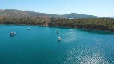 Croatia. Bay with yachts on the Adriatic coast. Summer. Tourist season. Popular place to relaxation. Drone. Aerial view. The camera moves forward