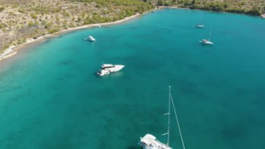 Croatia. Bay with yachts on the Adriatic coast. Summer. Tourist season. Popular place to relaxation. Drone. Aerial view. The camera moves forward