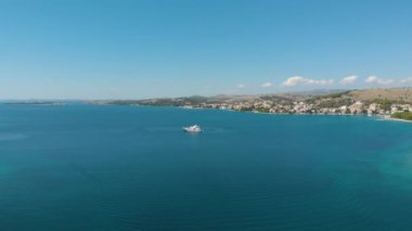 Croatia. Bay on the coast of the Adriatic Sea. Summer. Tourist season. Popular place to relaxation. Drone. Aerial view. The camera moves from left to right