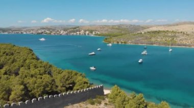 Croatia. Coast of the Adriatic Sea. Ruins of an ancient fortress. Summer. Tourist season. Popular place to relaxation. Drone. Aerial view. The camera moves forward