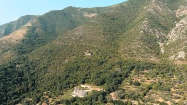 Montenegro. Abandoned catholic church high in the mountains. Drone. Aerial view. Fly. The camera moves forward