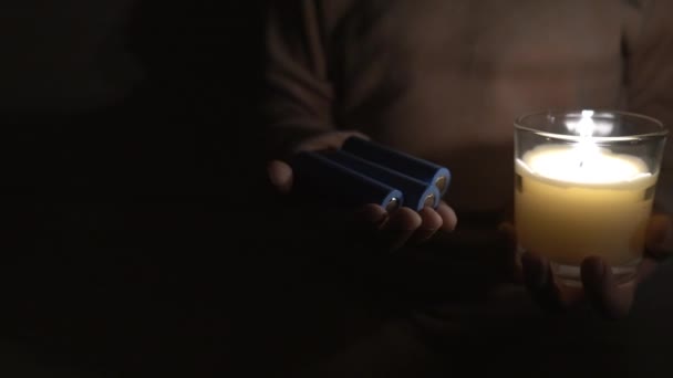 Girl Dark Room Holds Candle Batteries Her Hands Close Camera — Vídeo de stock