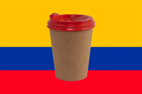 Disposable paper cup of coffee on the background of the national flag of Colombia (close-up). The largest exporter of coffee in the world. Colombian coffee. Product supply concept