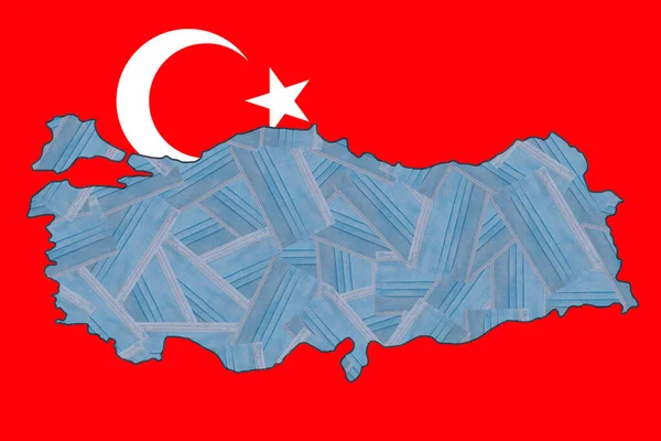 Randomly placed blue medical masks in the form of a geographical map of Turkey against the background of the national flag of Turkey. Mask mode. Pandemic. Quarantine. Zero Covid
