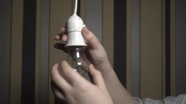 Girl Dark Room Unscrews Non Burning Electric Light Bulb Its — Stock videók