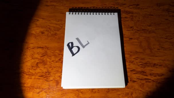 Notepad Wooden Table Lit Spotlight Inscription Blackout Appears Notepad Stop — 图库视频影像