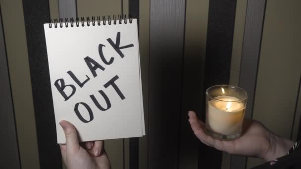 Notepad Inscription Blackout One Hand Burning Candle Other Hand Close — Video