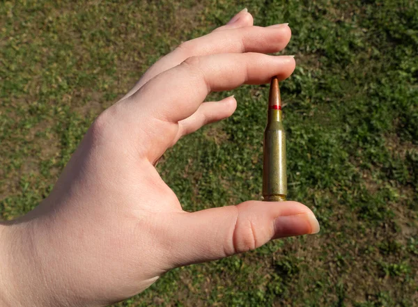 Rifle Cartridge Hand Background Green Grass Close — Stock Photo, Image