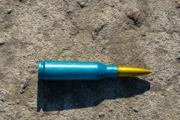 Yellow Blue Rifle Cartridge National Symbol Ukraine Lies Concrete Surface — Stock Photo, Image
