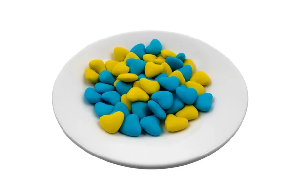 Beyaz Arka Planda Mavi Sarı Kalp Şeklinde Şekerler Yakın Plan — Stok fotoğraf