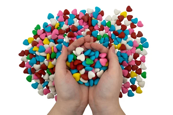 Garstka Wielobarwnych Cukierków Kształcie Serca Rękach Odizolowanych Białym Tle Zbliżenie — Zdjęcie stockowe