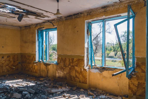 View from inside a house destroyed by shelling. War in Ukraine. Russian invasion of Ukraine. Destruction of infrastructure. Terror of civilians. War crimes