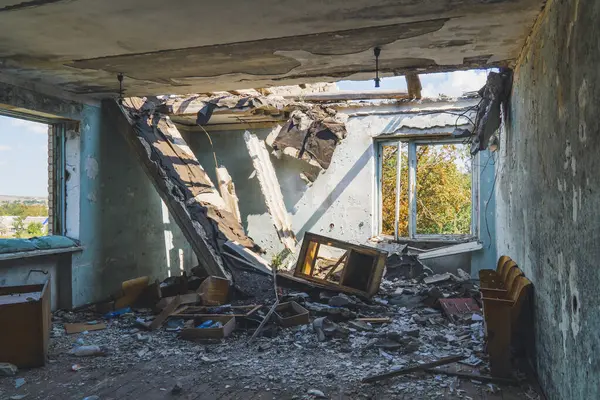 View from inside a house destroyed by shelling. War in Ukraine. Russian invasion of Ukraine. Destruction of infrastructure. Terror of civilians. War crimes