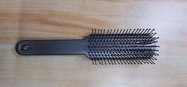 Close-up of Black Plastic Comb for hair care