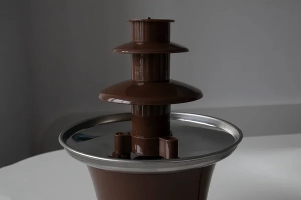 Chocolate fountain. Party device that melts chocolate.