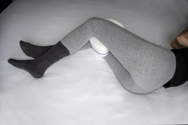 Young Woman Pajama Pants Anatomical Pillow Her Legs Knees Lying — Foto Stock