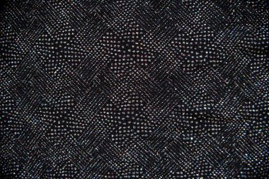 80 'lerin tarzında siyah kumaşlar ve pullar. Neşeli arkaplan, kopyalama alanı.