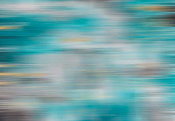 Abstract turquoise background with white and yellow patches in blurred motion. Antique tone colour filter style.
