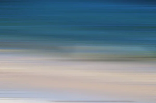 Dreamy abstraction of the sea at sunset with a blur effect. Dark ocean, Simple backdrop. Motion blur