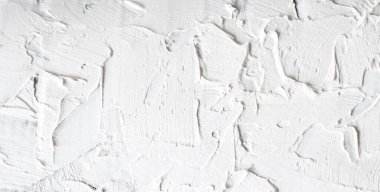 Beyaz duvar macunu dokusu, pürüzlü grunge yakın plan pankart veya panorama formatında. Alçı taşı dokusu