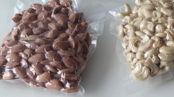 Cashews Almonds Vacuum Bags White Background Slow Chamber Movement — Stock videók