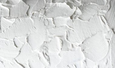 Macro photo of a white rough wall. Close-up of the putty.