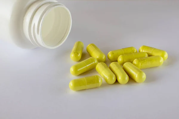 Jar Food Supplements Lies Next Sprinkled Yellow Quercetin Capsules White — Zdjęcie stockowe