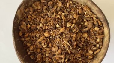 Dried burdock root in close-up, slow motion