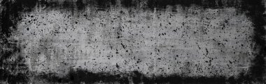 Black and white grunge background with spray paint. Banner or panorama shape for a design or ad. Dark frame