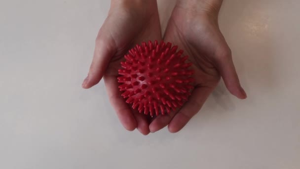 Close Two Female Hands Holding Red Spiked Massage Myofascial Release — Stockvideo
