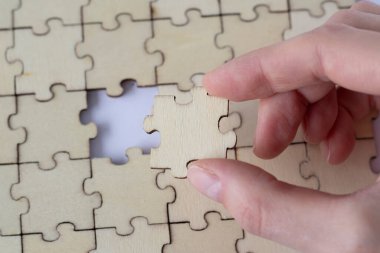 Missing piece of the blank puzzle. Concept of absence and incomplete. Putting the last piece finding solution.