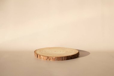 Wooden catwalk on a beige background. A space for your item, cosmetics, Bud or other